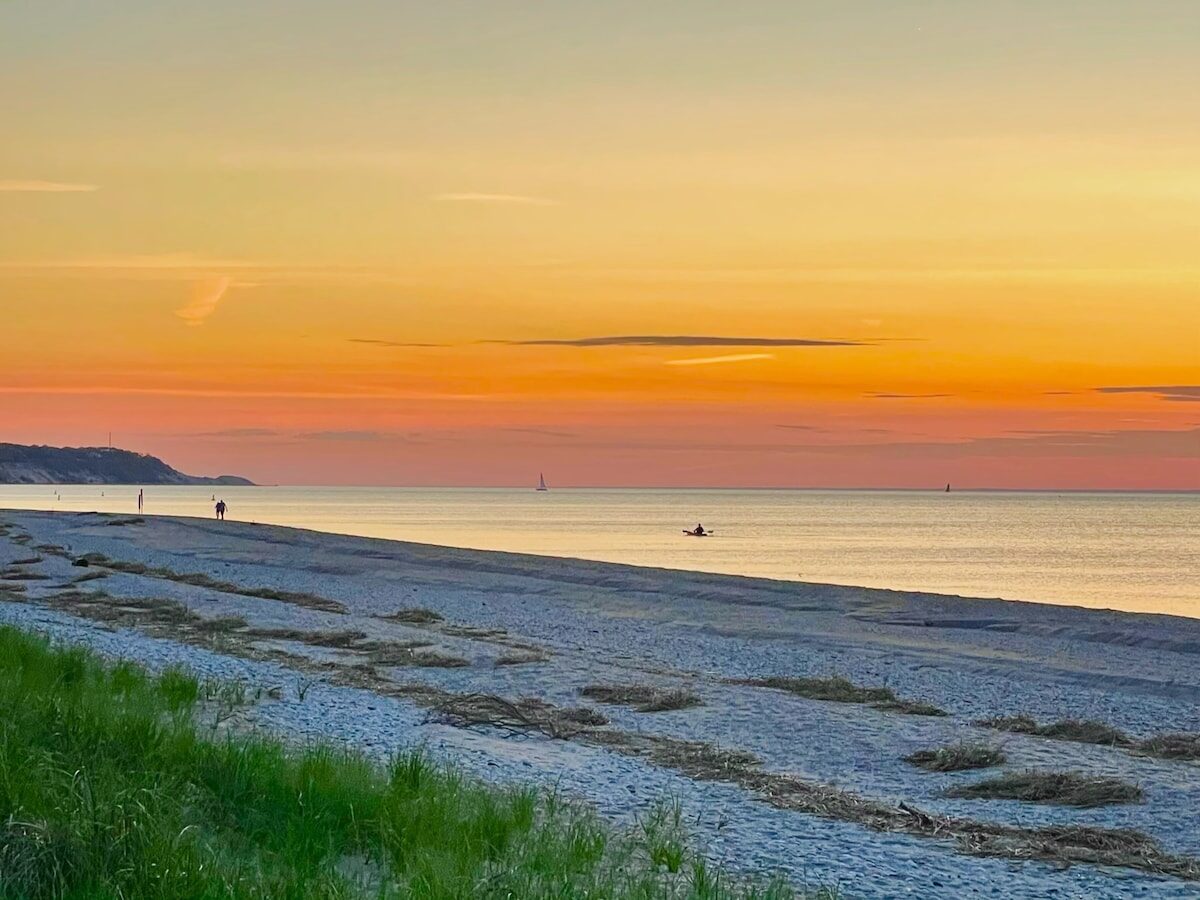 Ocean House private beach at golden hour sunset — beachfront vacation rental, Long Island Sound, North Shore NY