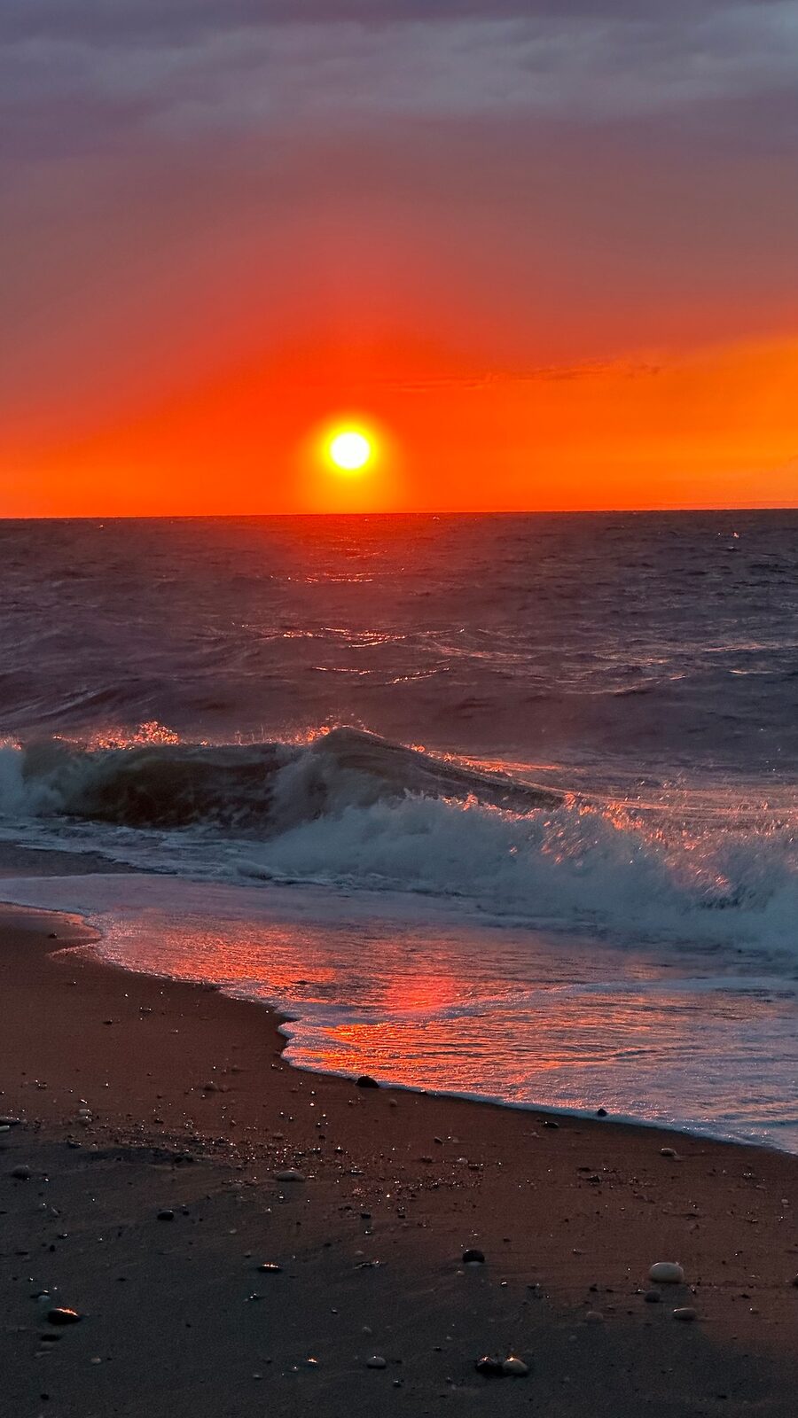 Dramatic sunset over Long Island Sound from Ocean House fire pit deck — waterfront villa rental, North Shore Long Island